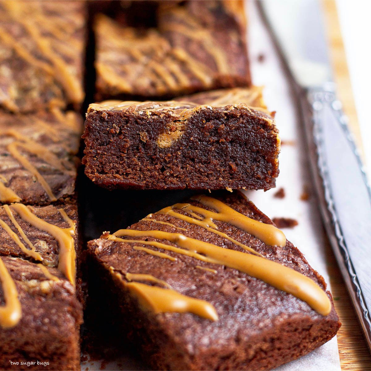 a brownie leaning on top of other brownies