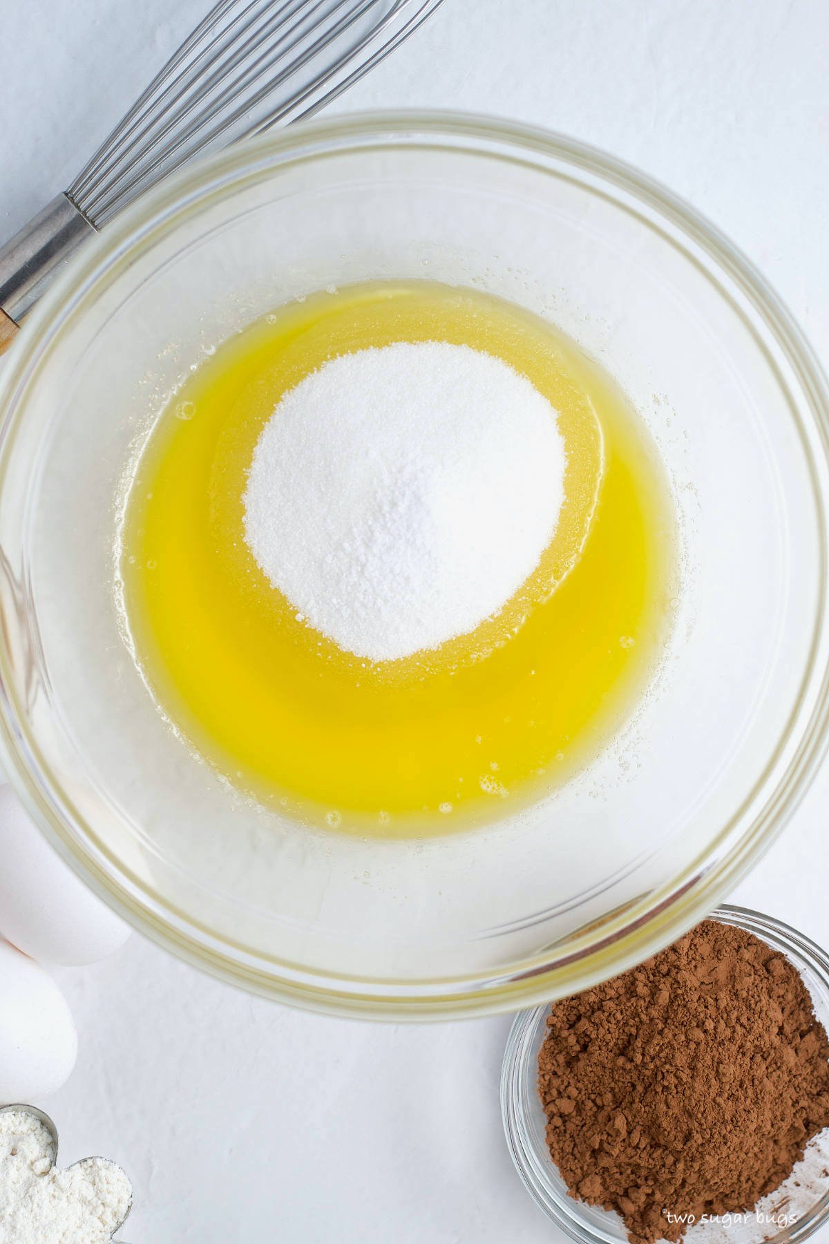 melted butter and sugar in a mixing bowl